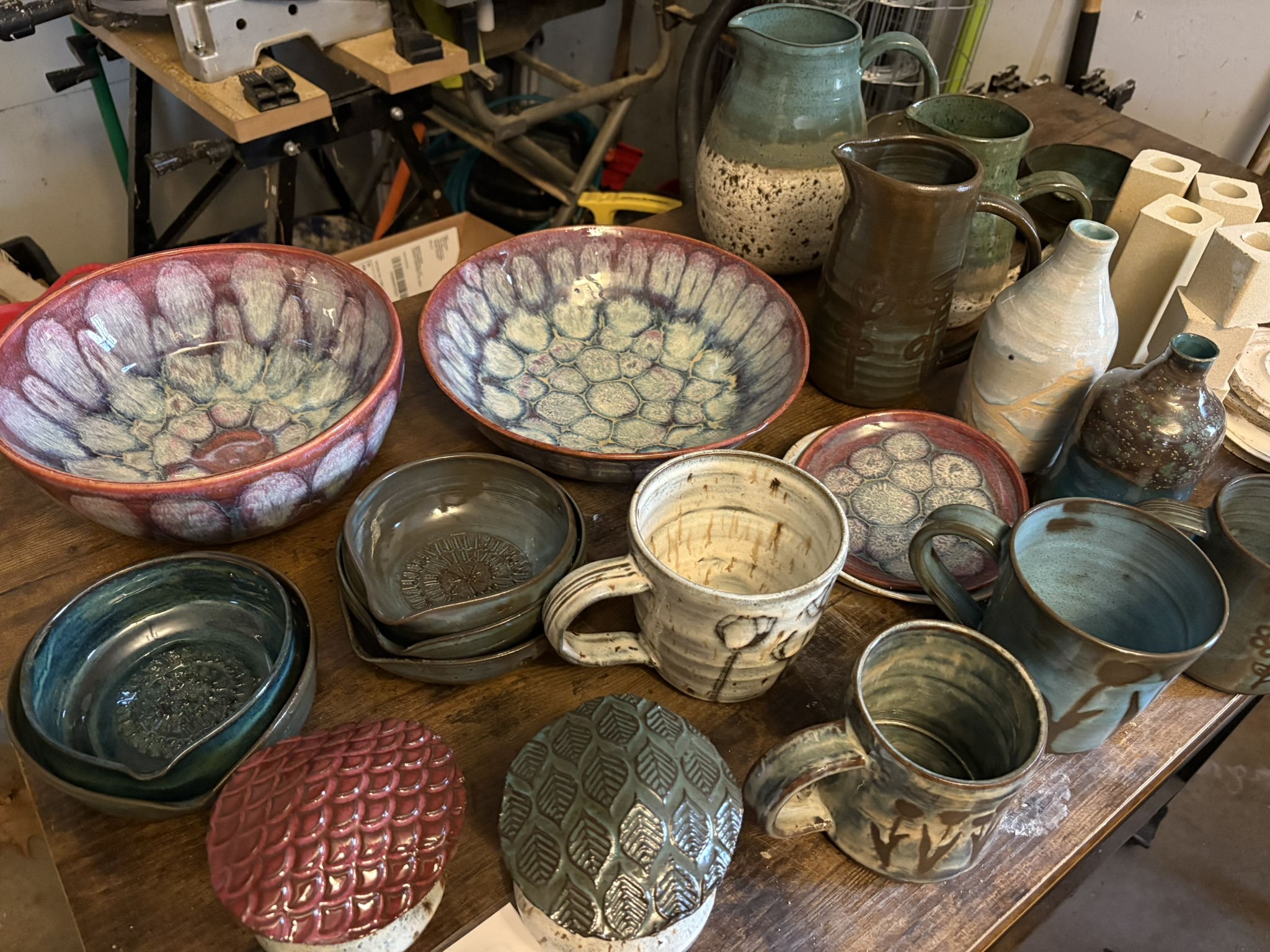 A broad collection of handmade pottery in the studio
