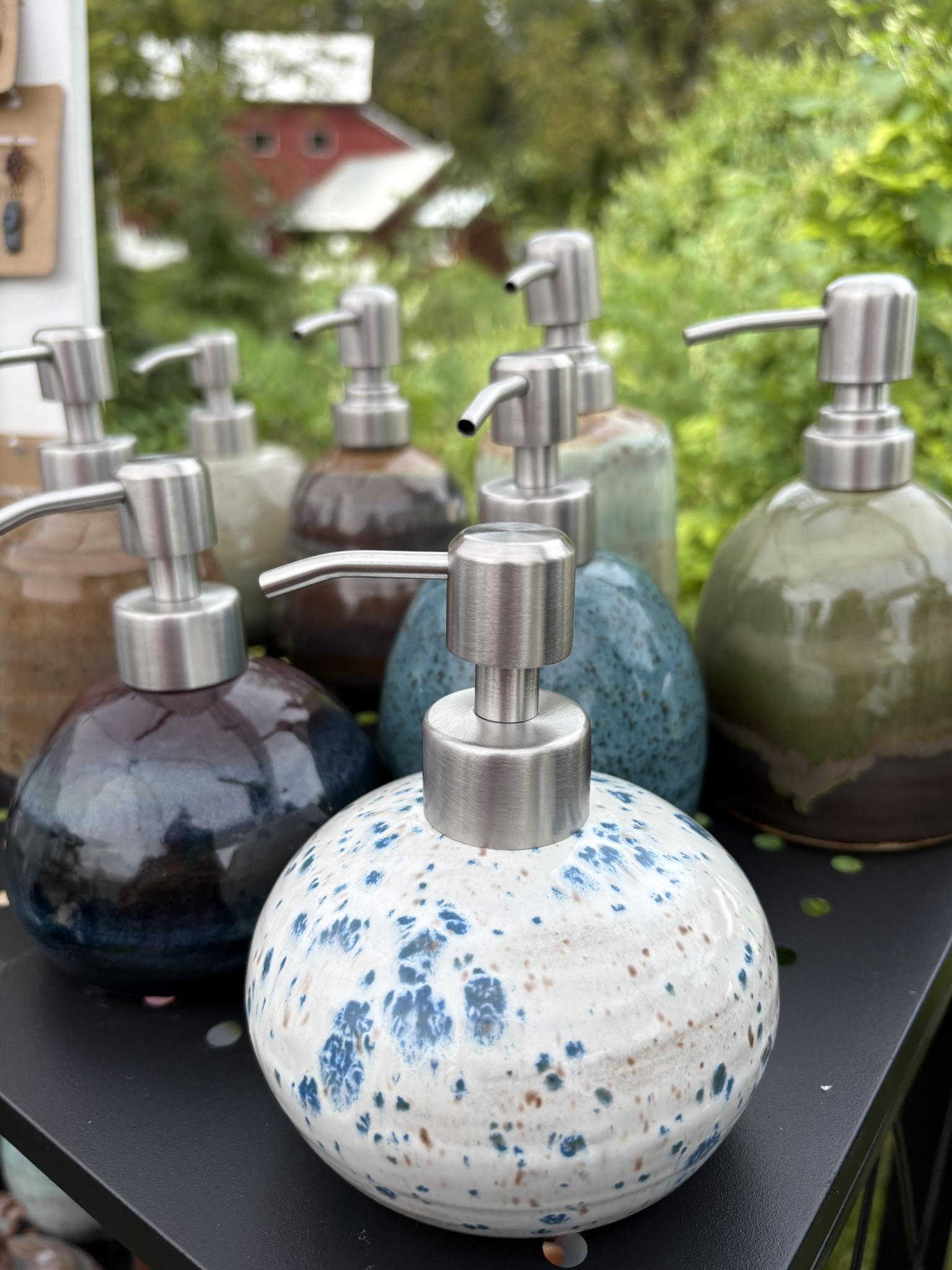 Handmade ceramic soap dispensers in varied glazes