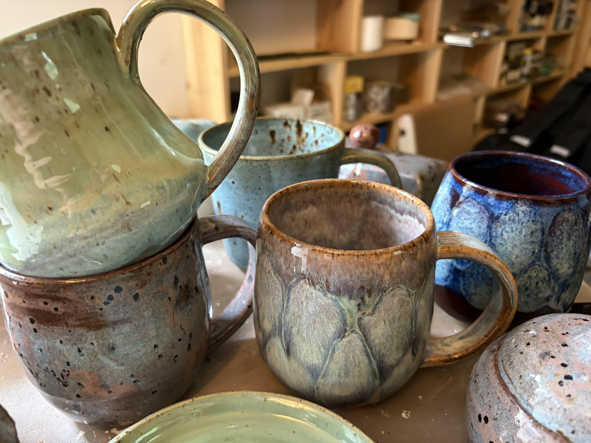 Handmade mugs in layered earthy glazes