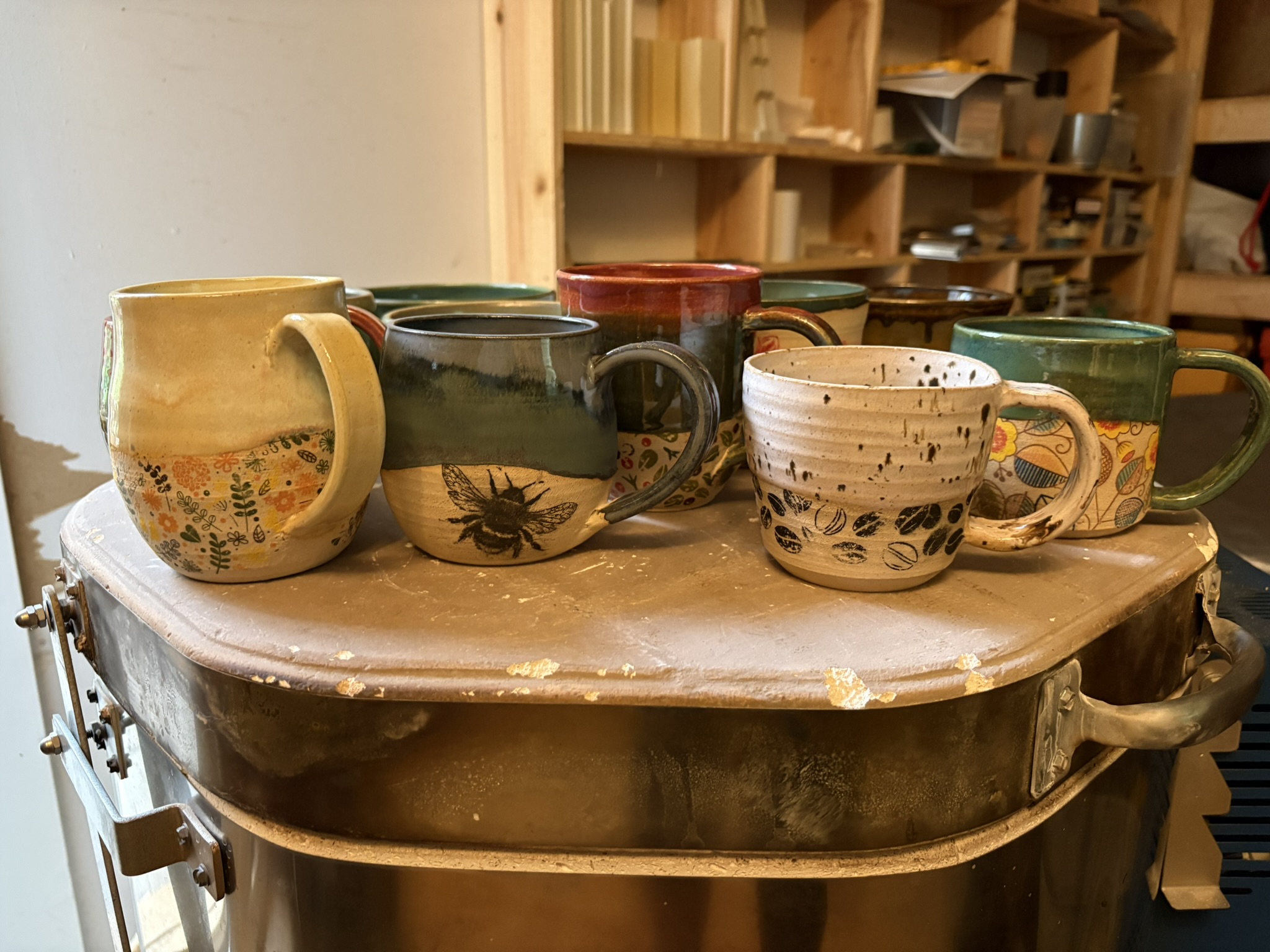 A group of patterned handmade mugs